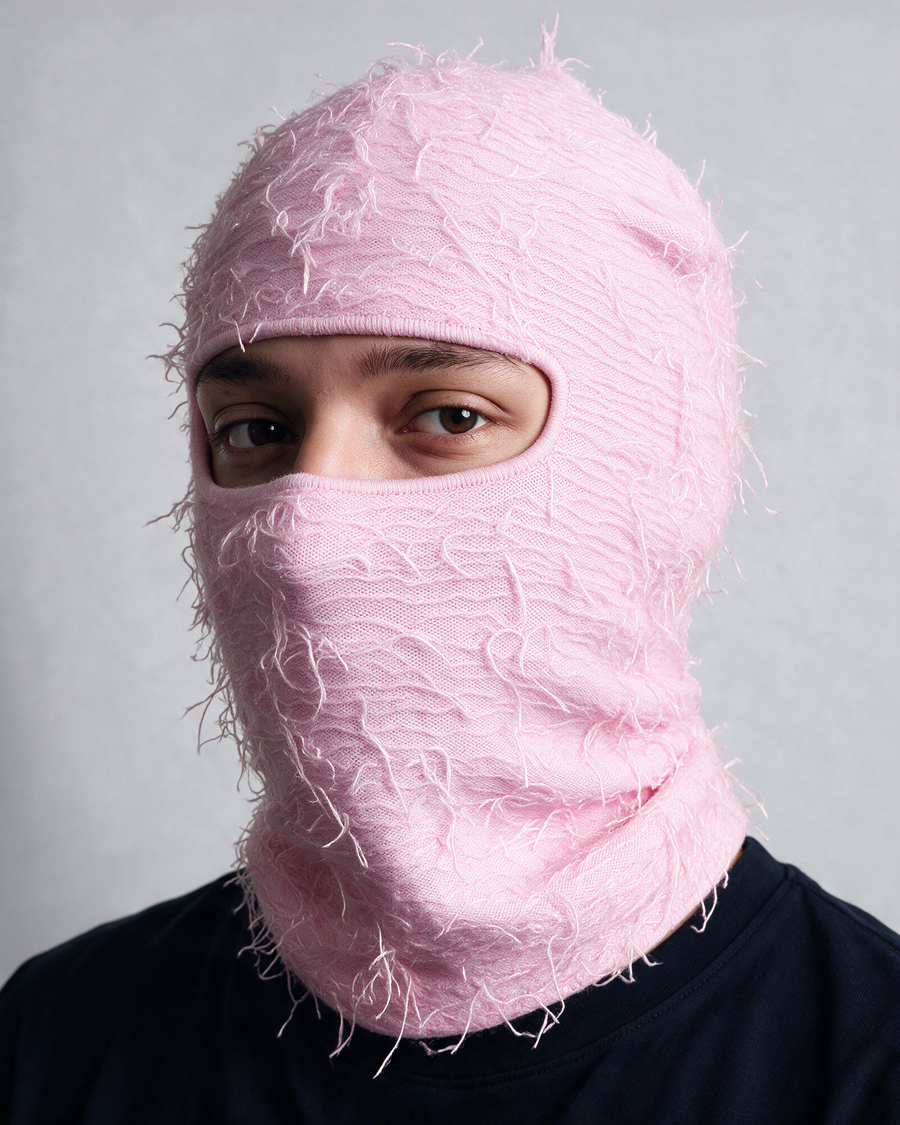 Pink distressed knit balaclava worn portrait
