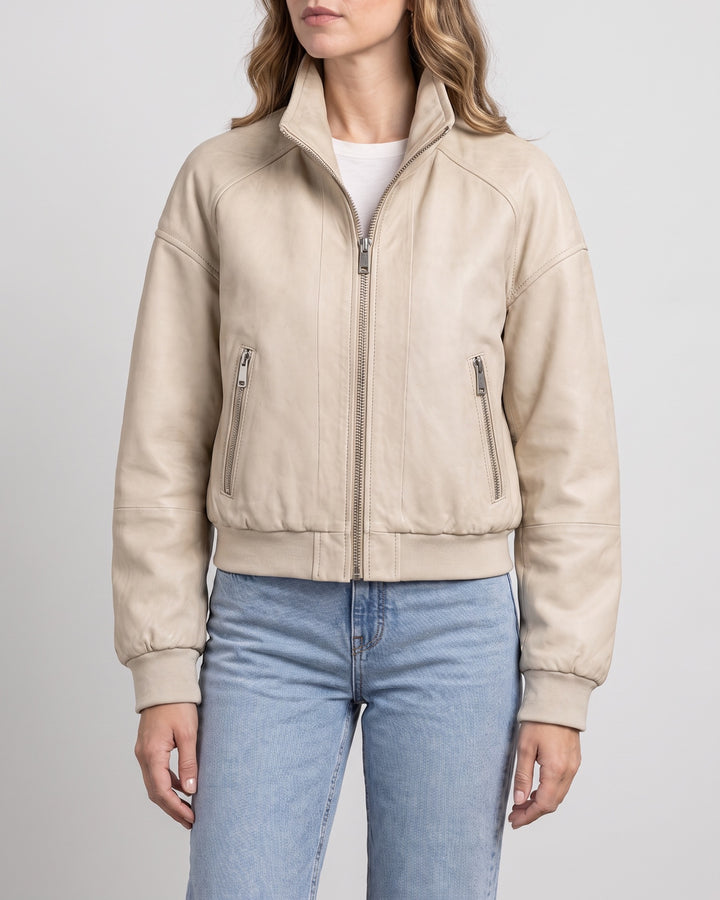 Women's Twila Cropped Leather Bomber Jacket — Cream on light gray background