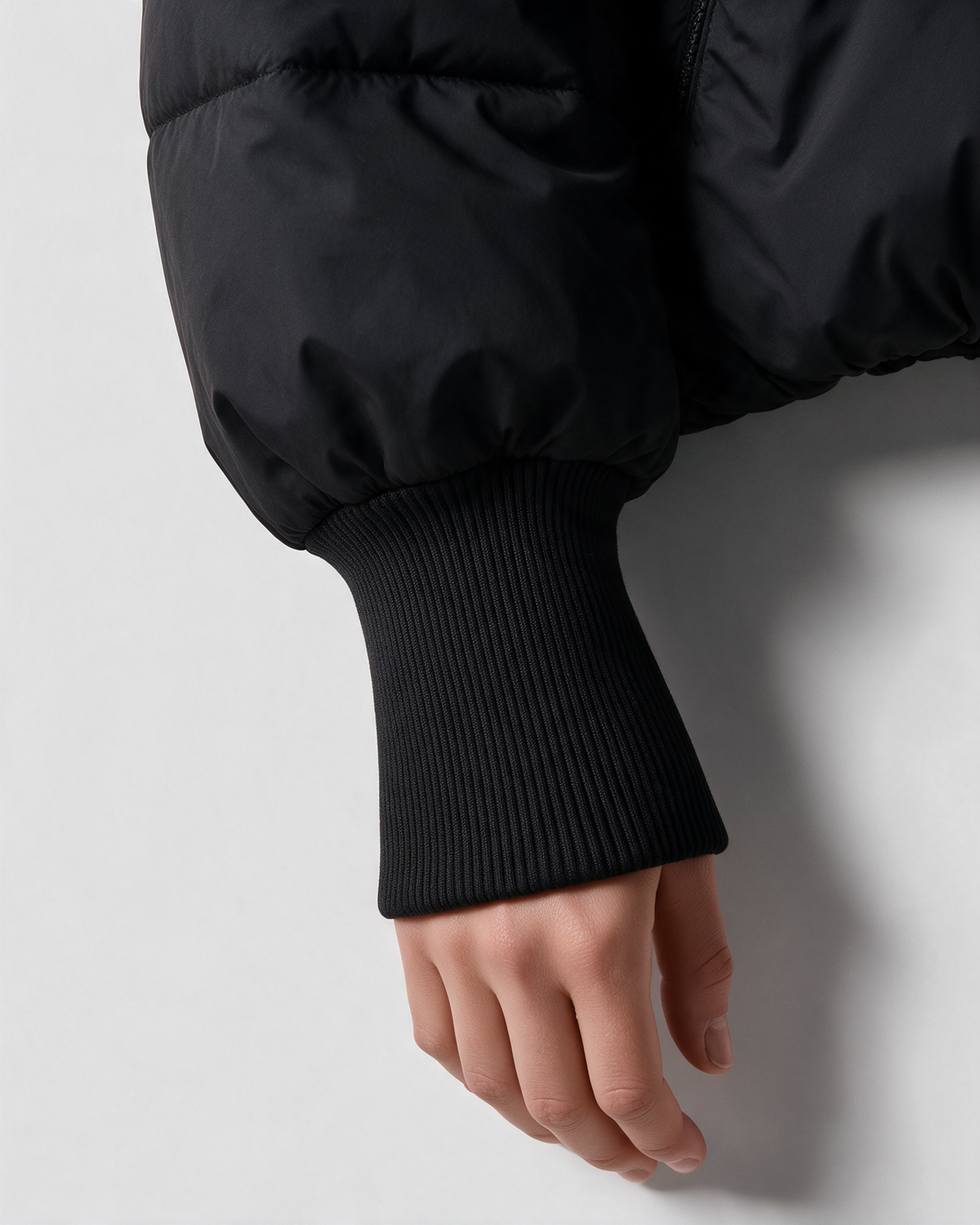 Black quilted jacket ribbed cuff detail
