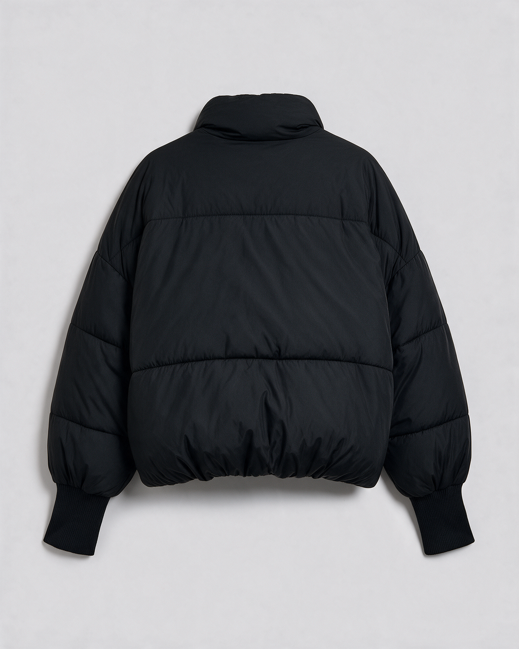 Black quilted jacket rear view