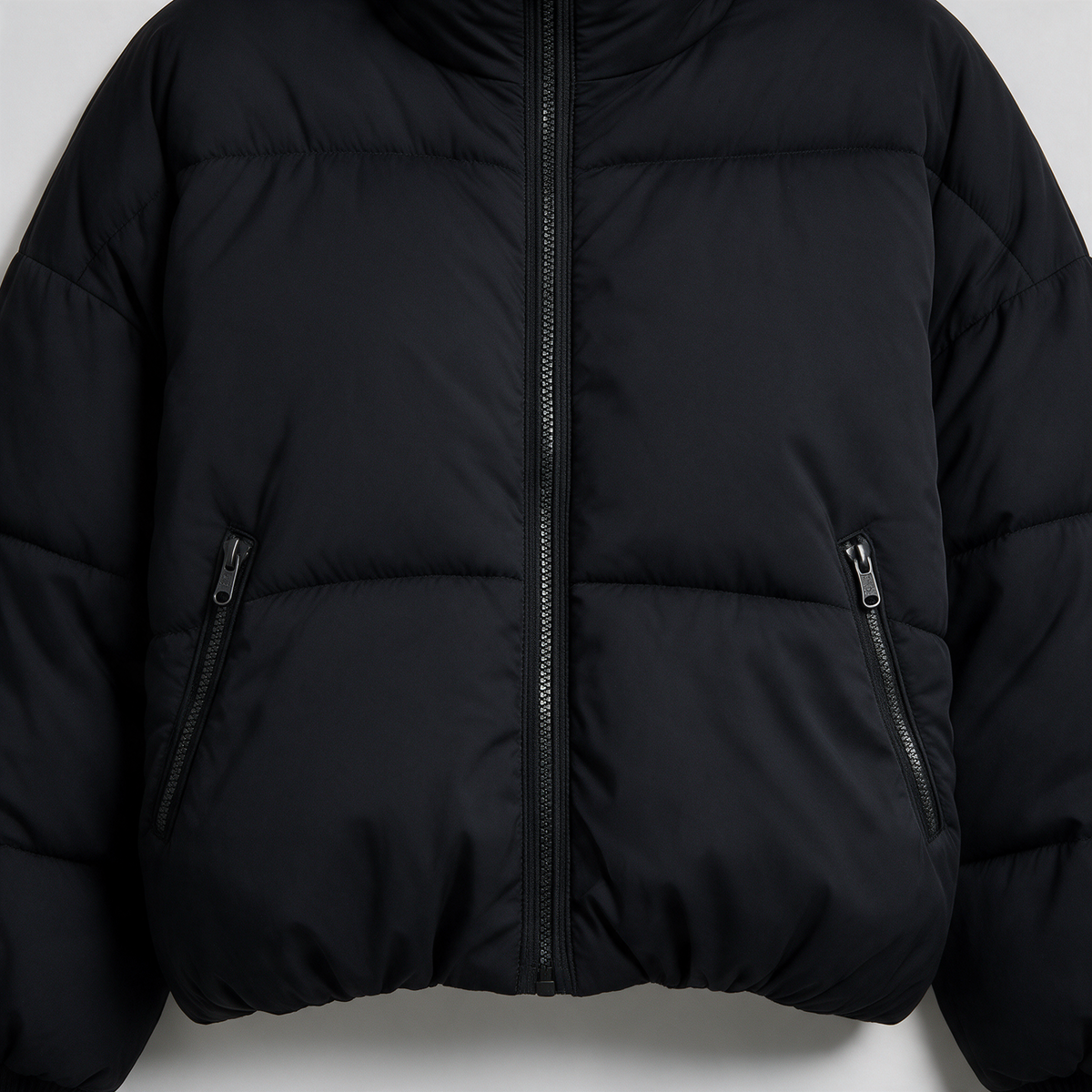 Black quilted jacket zipper detail