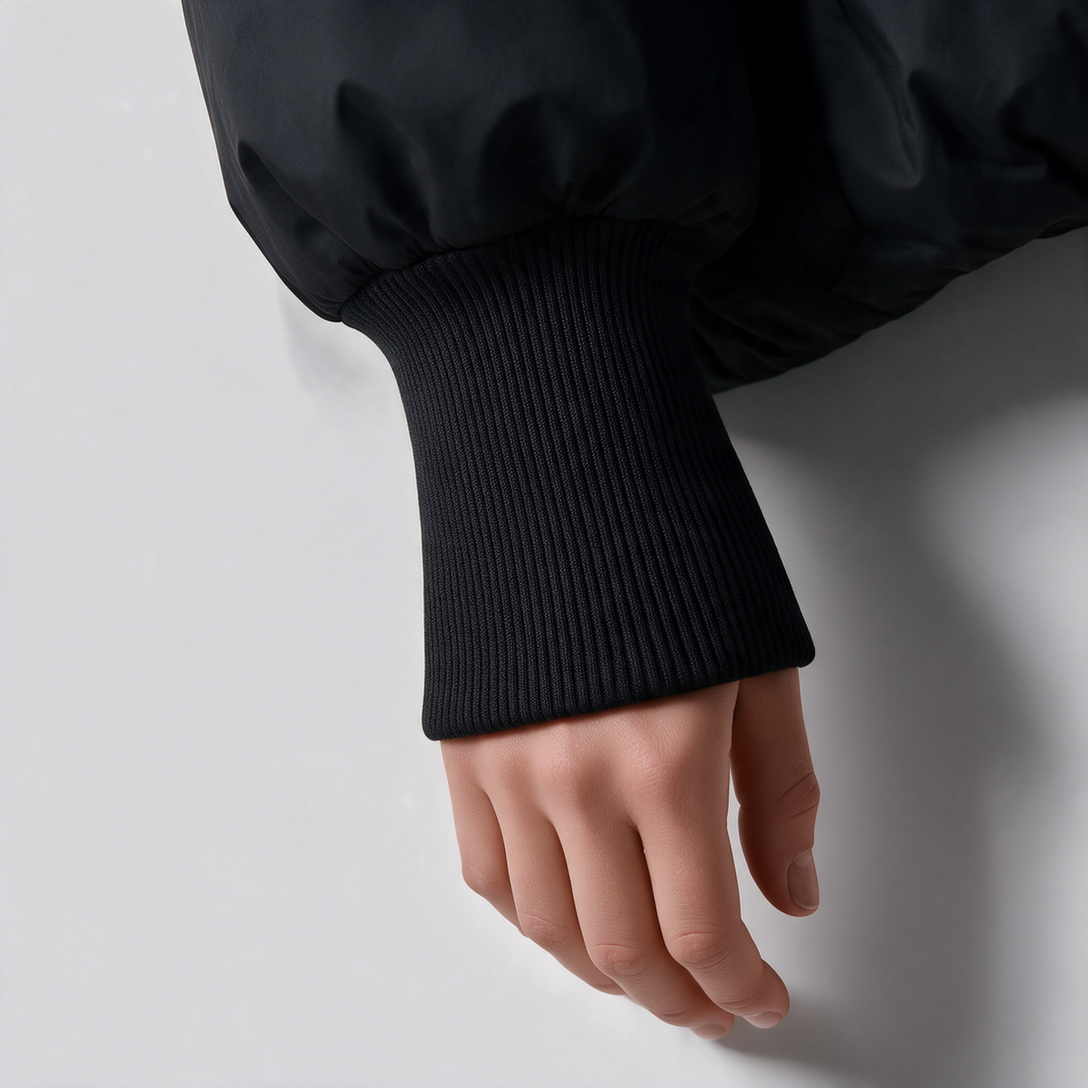 Black quilted jacket ribbed cuff detail