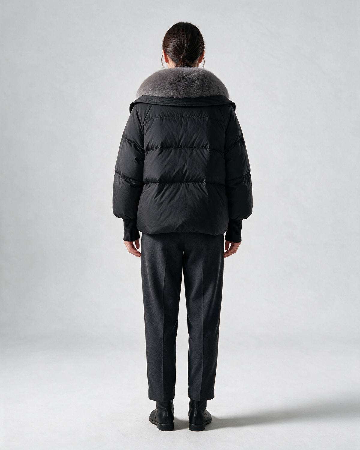 Black padded jacket, full rear view.