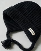 Women's knit earflap hat with braided ties — Black, fit and construction detail