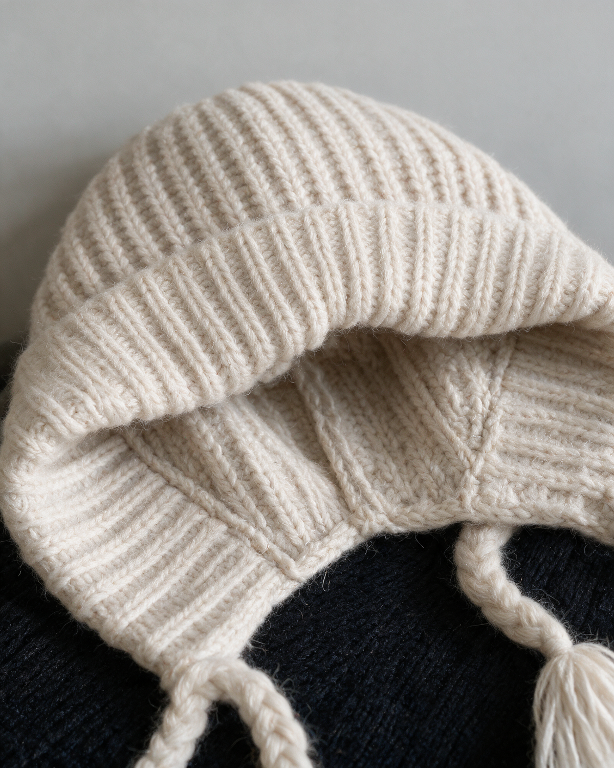 Women's knit earflap hat with braided ties — Off-White, knit texture detail