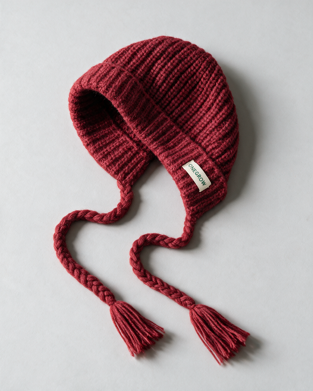 Women's knit earflap hat with braided ties — Red, product-only view