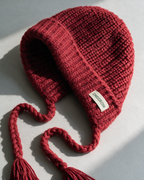 Women's knit earflap hat with braided ties — Red, knit texture detail