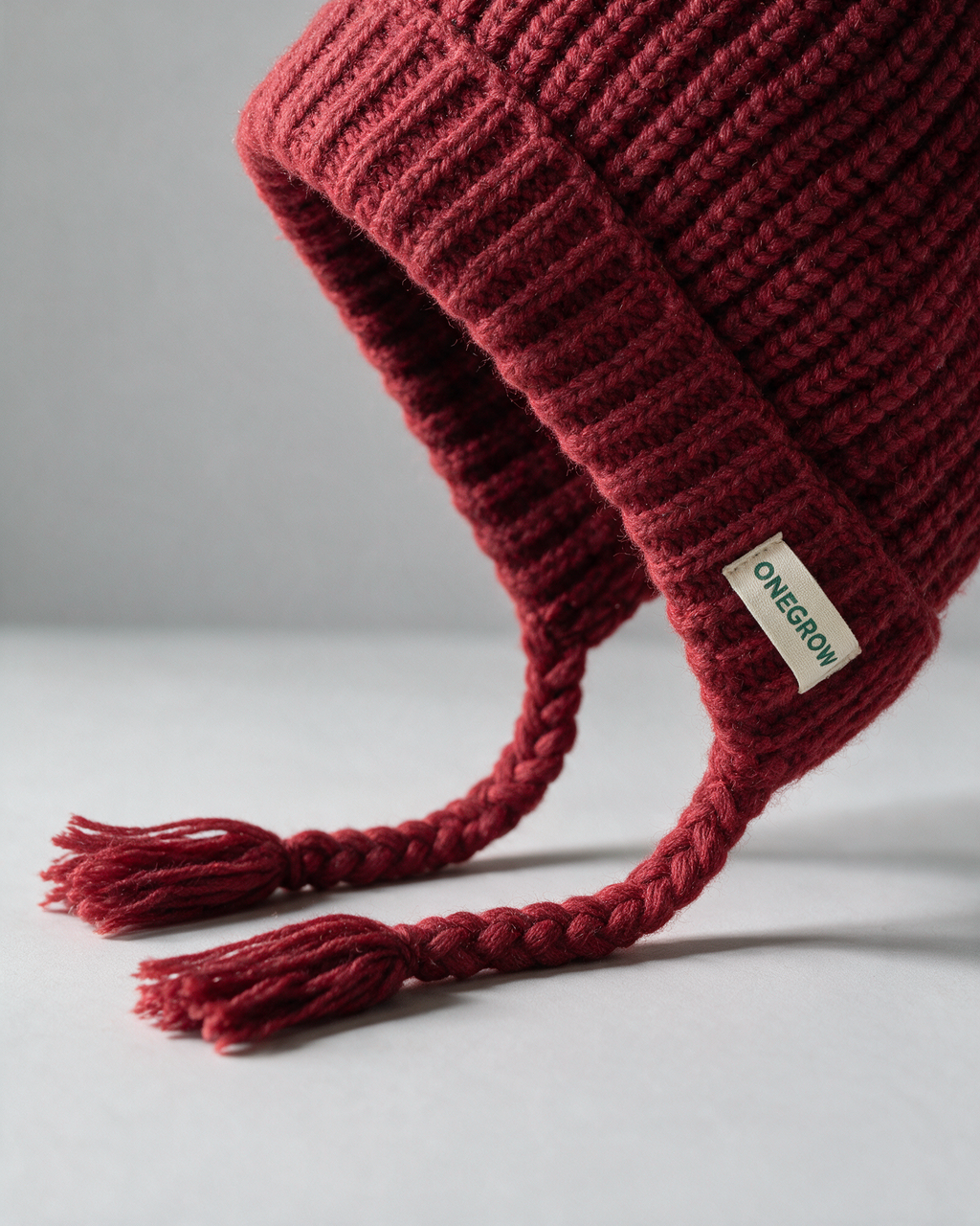 Women's knit earflap hat with braided ties — Red, fit and construction detail