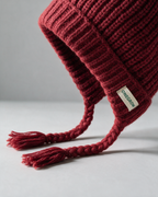 Women's knit earflap hat with braided ties — Red, fit and construction detail