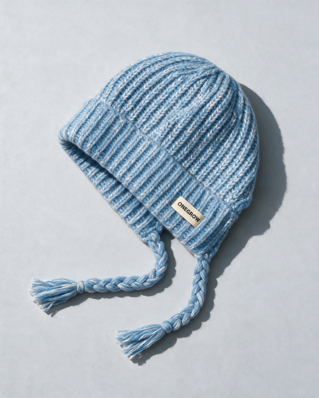 Women's knit earflap hat with braided ties — Blue, product-only view