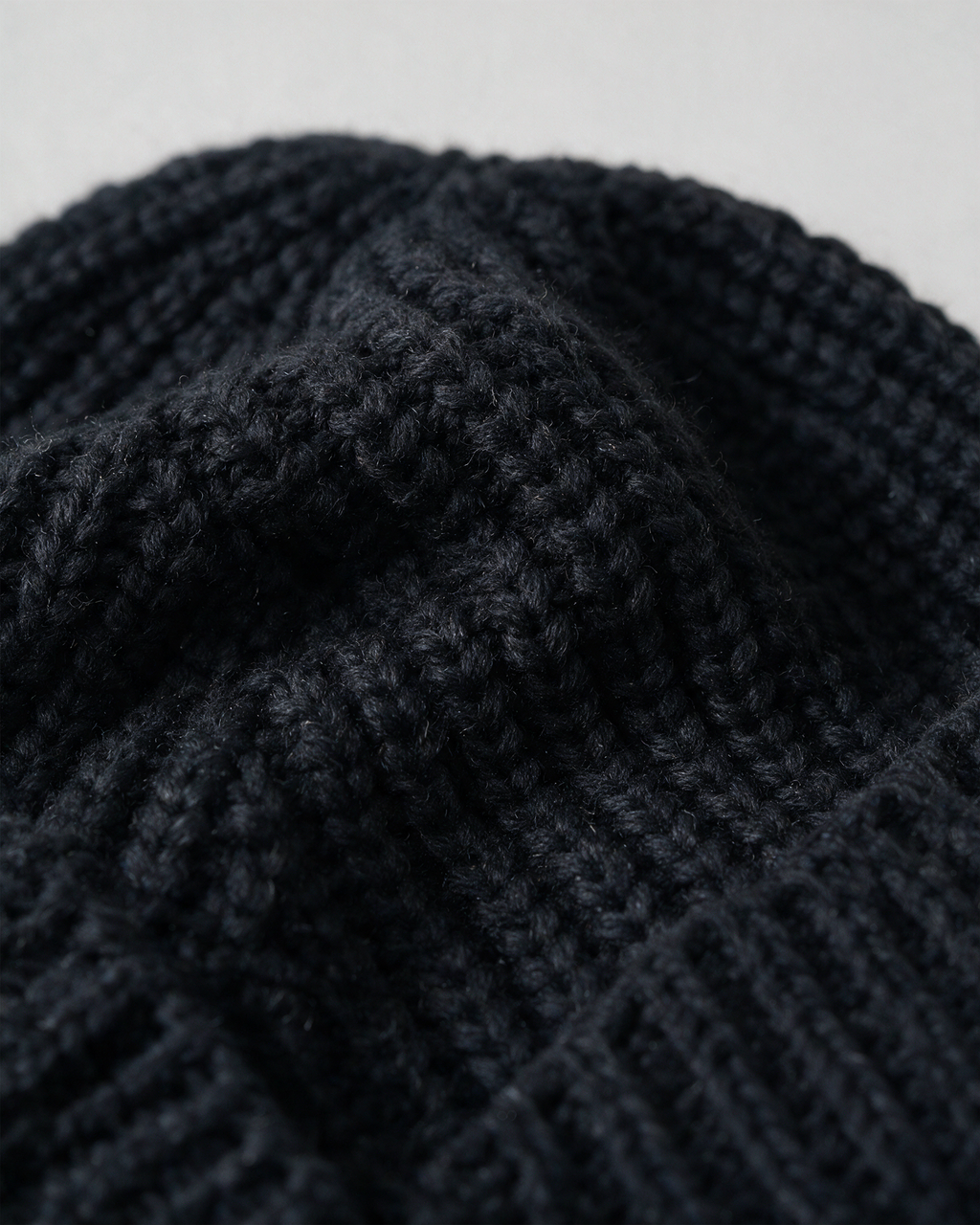 Women's knit earflap hat with braided ties — Black, knit texture detail