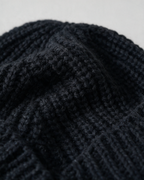 Women's knit earflap hat with braided ties — Black, knit texture detail