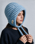 Women's knit earflap hat with braided ties — Blue, on model, front view