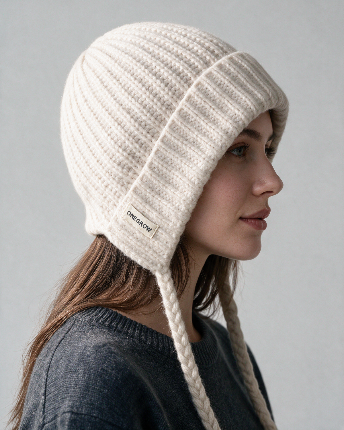 Women's knit earflap hat with braided ties — Off-White, on model, alternate view