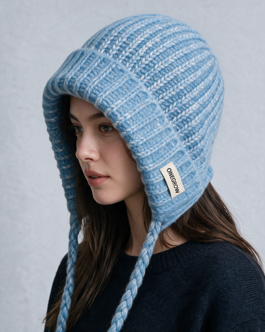 Women's knit earflap hat with braided ties — Blue, on model, alternate view