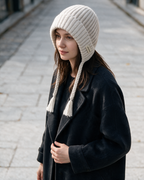 Women's knit earflap hat with braided ties — Off-White, on model, styled view