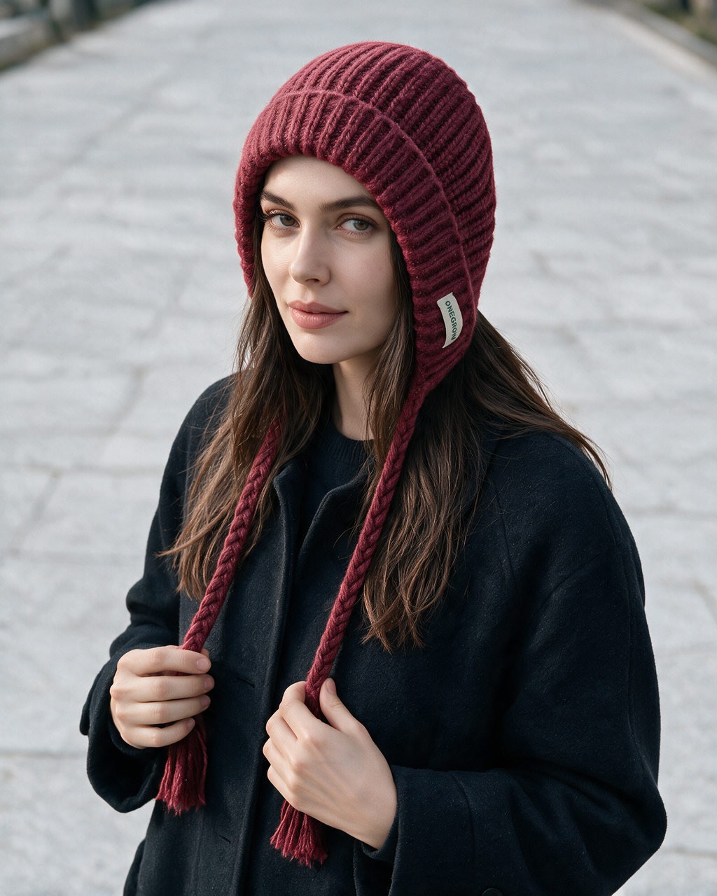 Women's knit earflap hat with braided ties — Red, on model, styled view