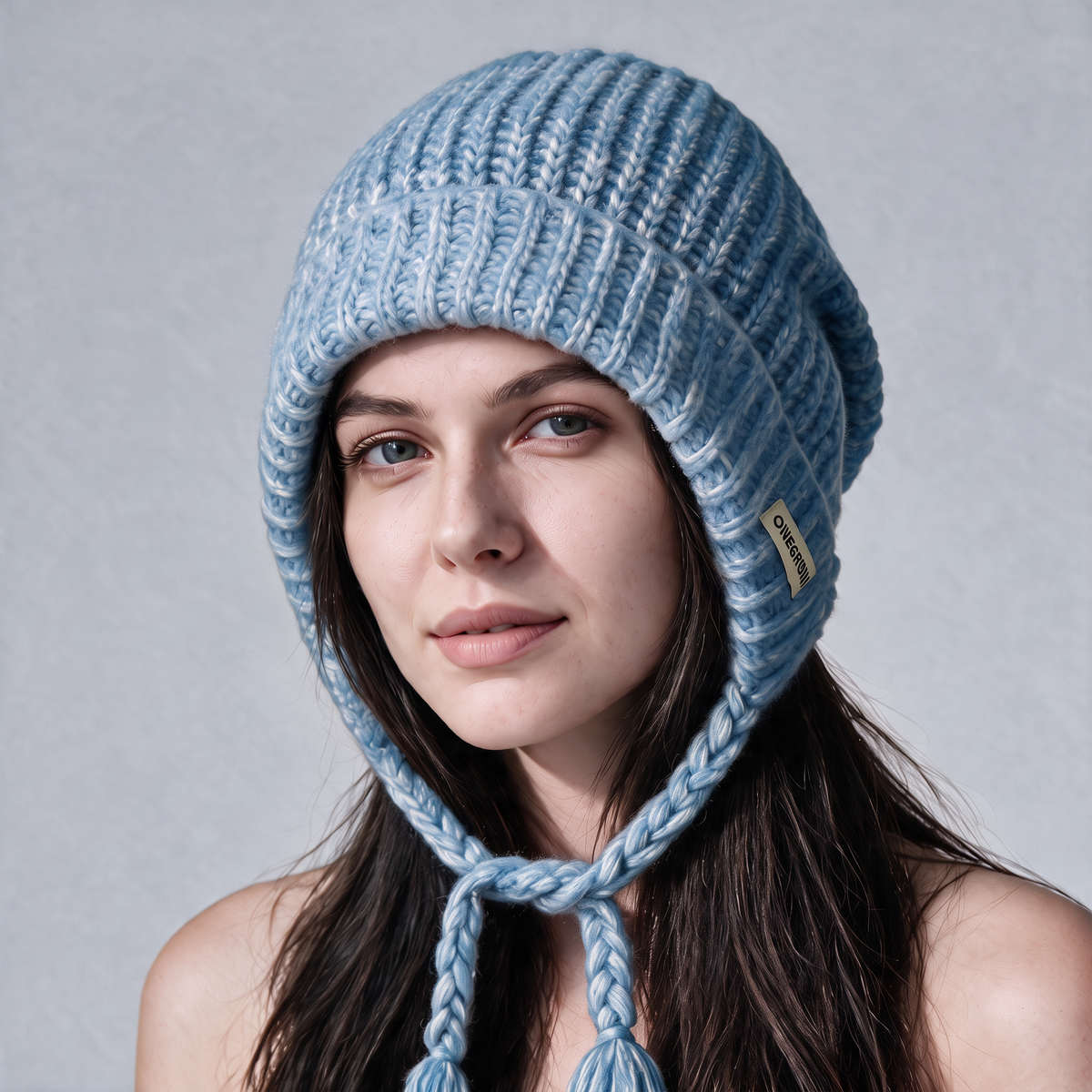 Blue earflap hat on model