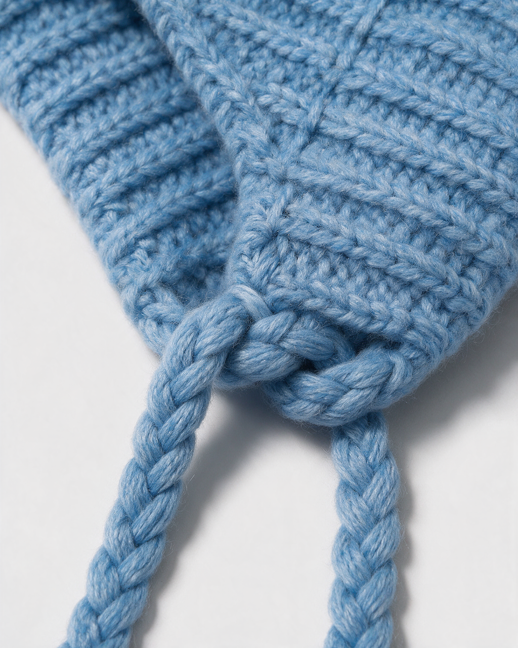 Women's knit earflap hat with braided ties — Blue, fit and construction detail