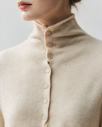 Cream button-front high-neck sweater collar