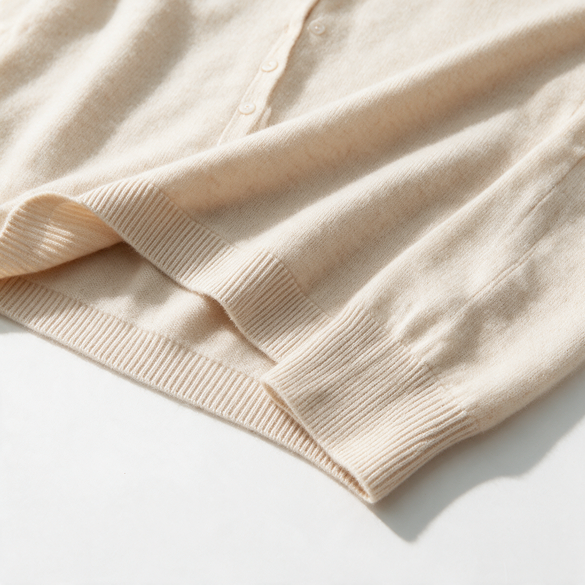 Cream button-front high-neck sweater feature3