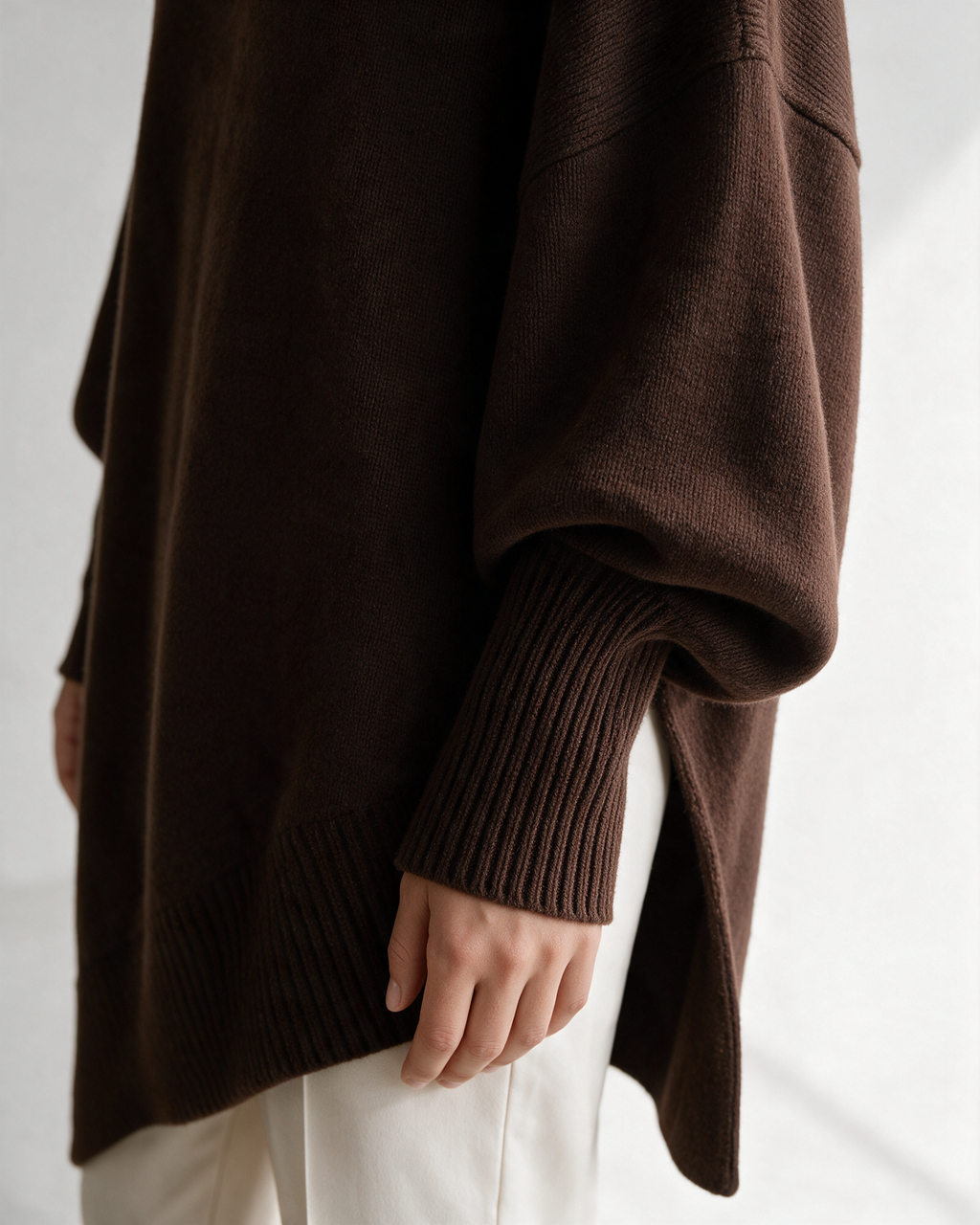 Brown oversized crewneck sweater detail