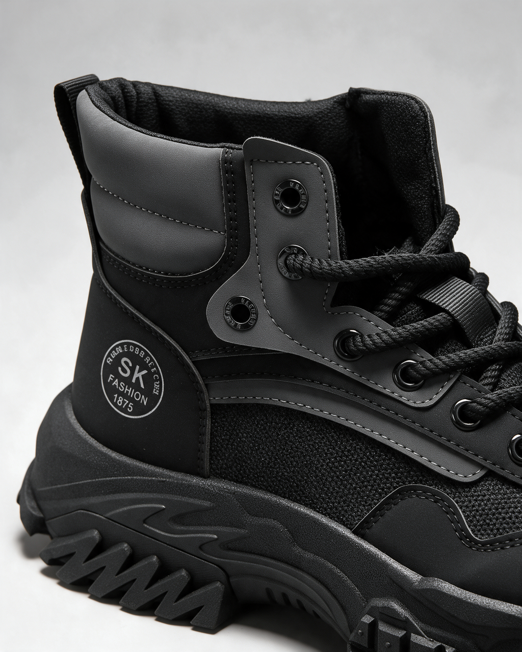 Black mesh-panel lace-up boot — opening