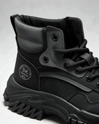 Black mesh-panel lace-up boot — opening