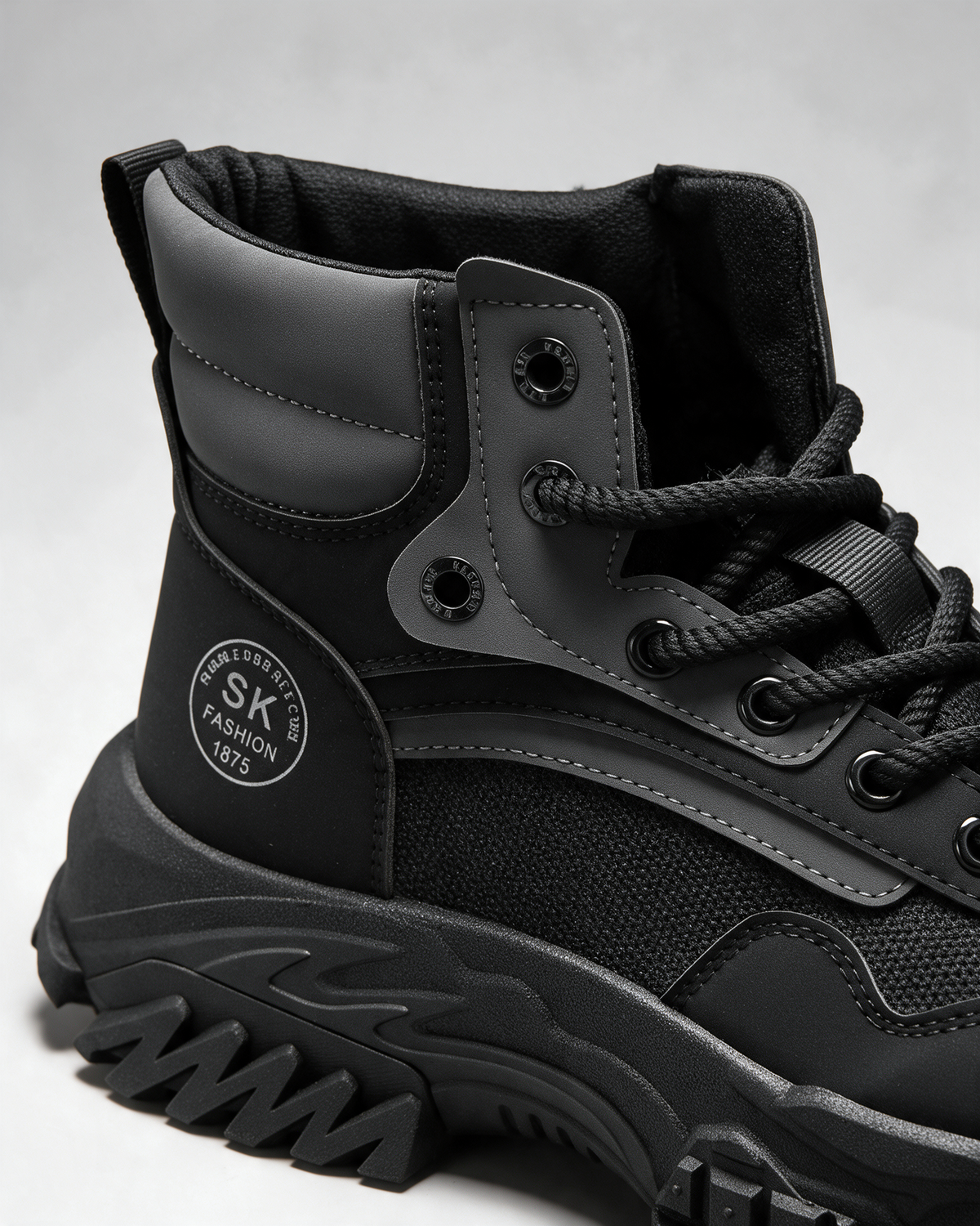 Black mesh-panel lace-up boot — opening