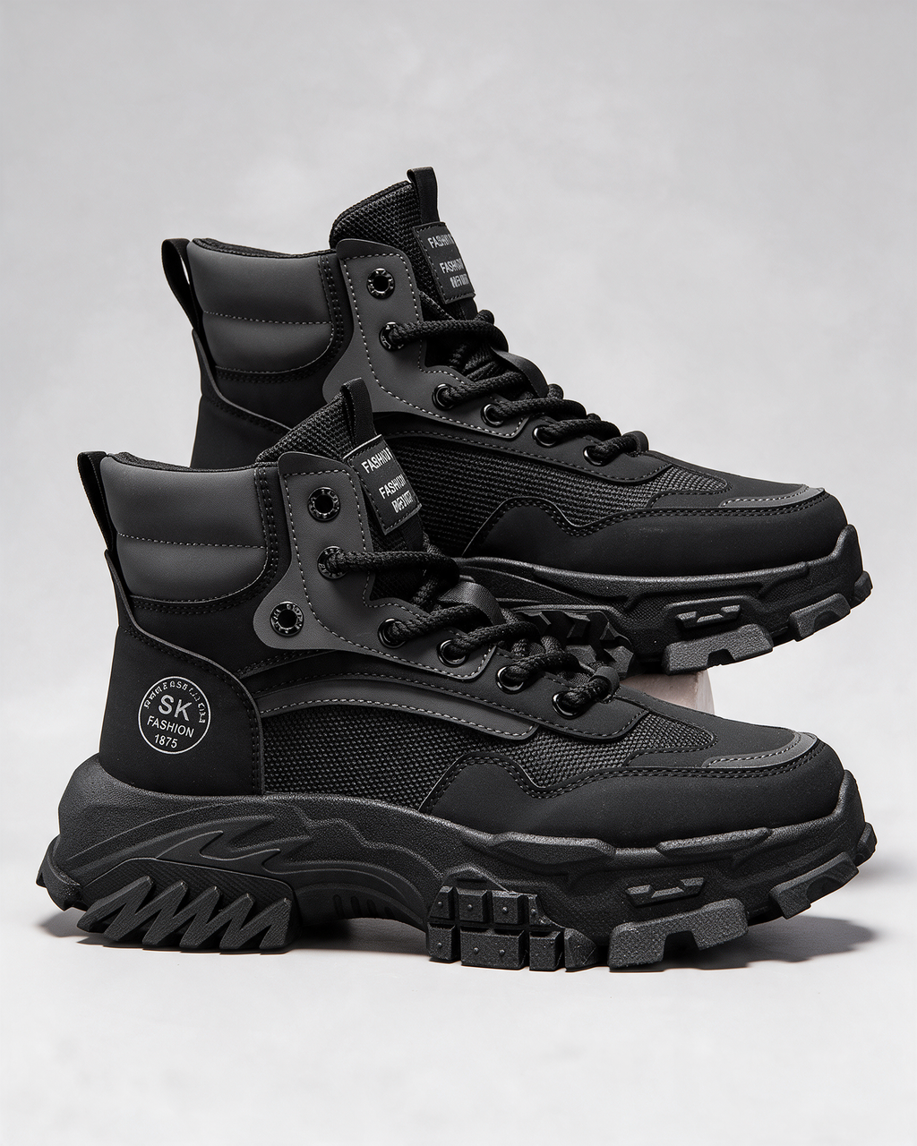 Black mesh-panel lace-up boot — construction