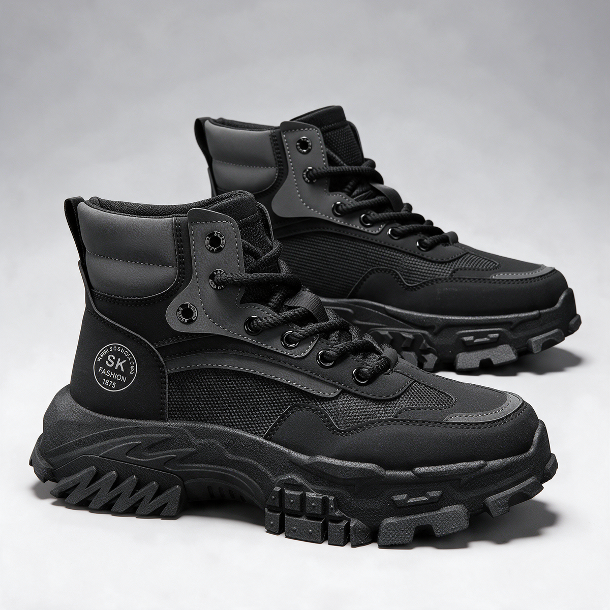 Black mesh-panel lace-up boot — feature0