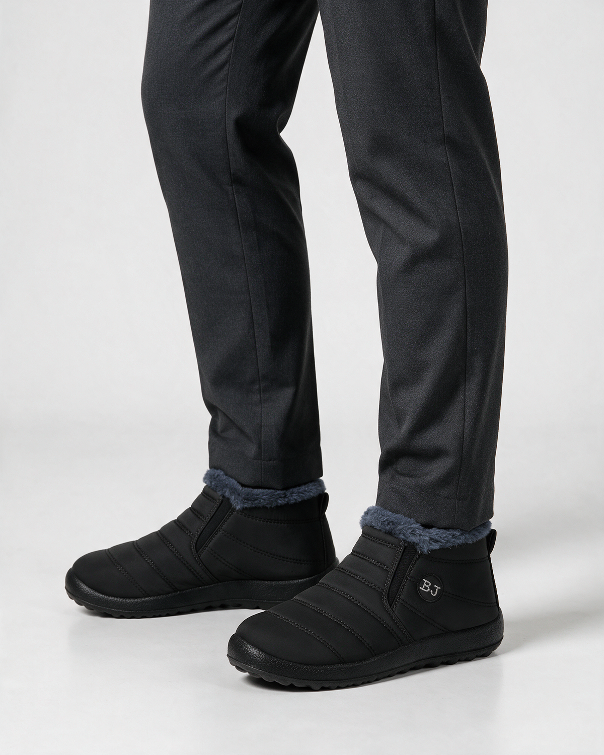 Black plush-lined ankle boots wearing