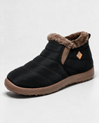 Black ankle boots with brown trim — opening