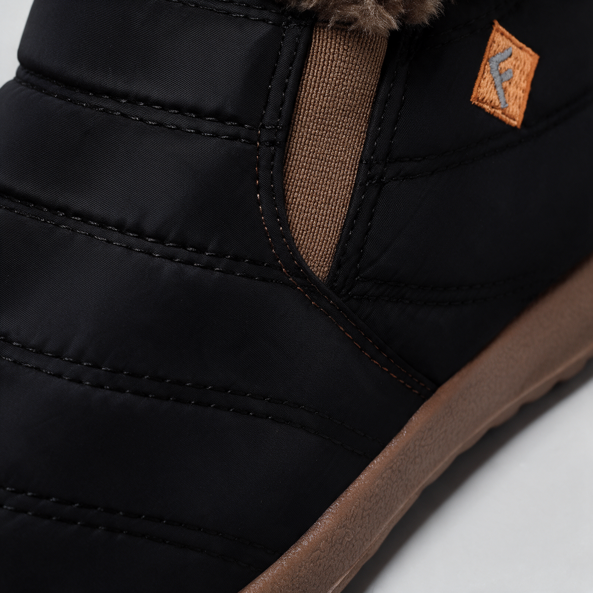 Black brown-trim boots — feature3