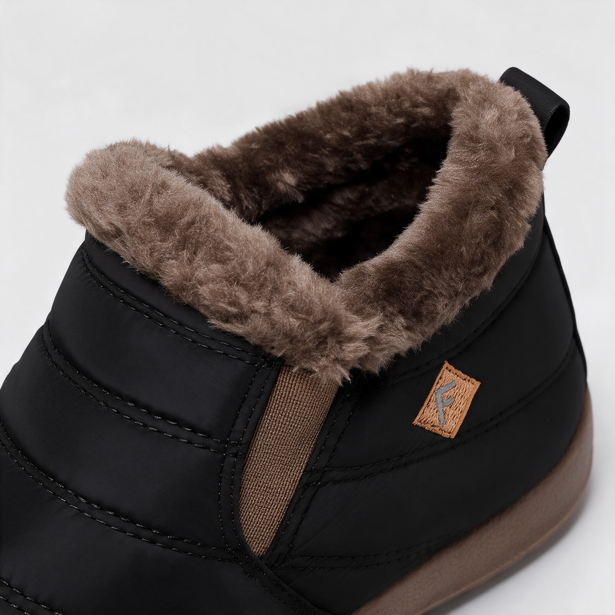 Black brown-trim boots — feature4