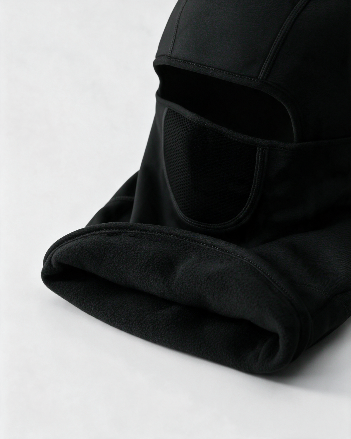 Black fleece-lined balaclava — fleece lining detail on light gray