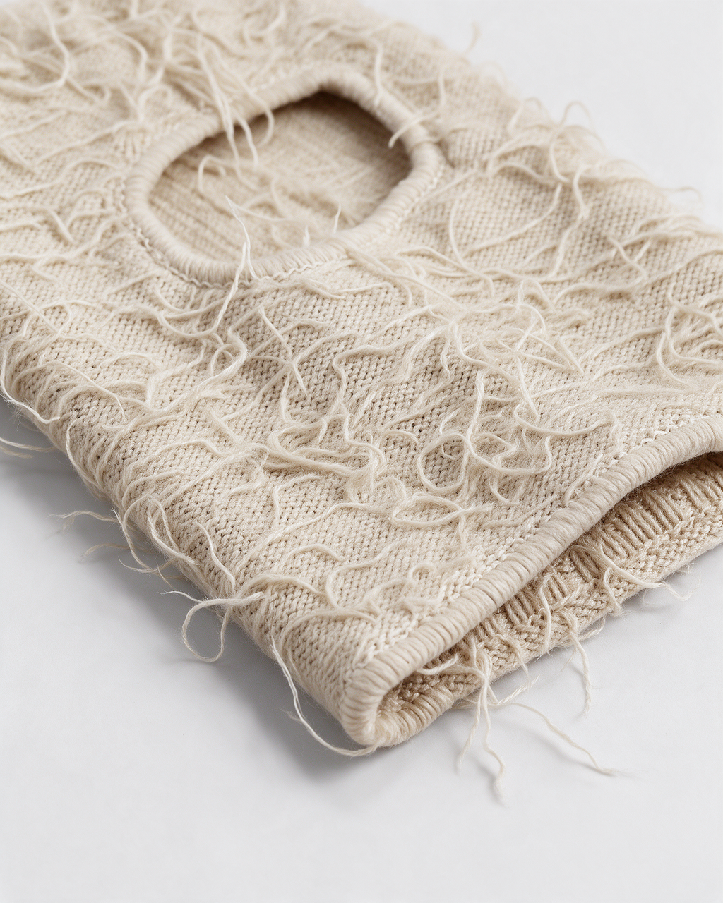 Beige distressed-knit balaclava — material close-up