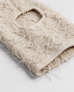 Beige distressed-knit balaclava — material close-up