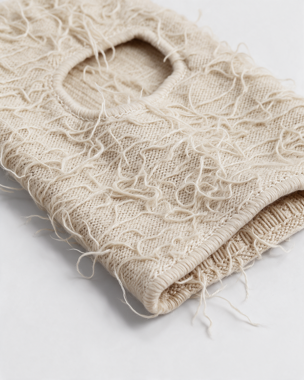 Beige distressed-knit balaclava — material close-up