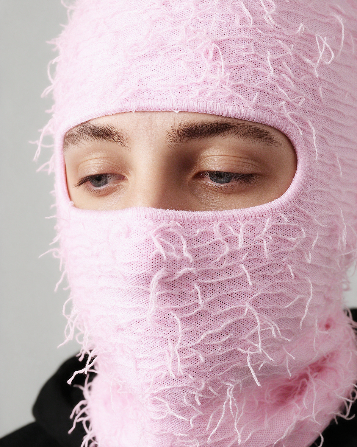 Pink distressed-knit balaclava — eye opening detail