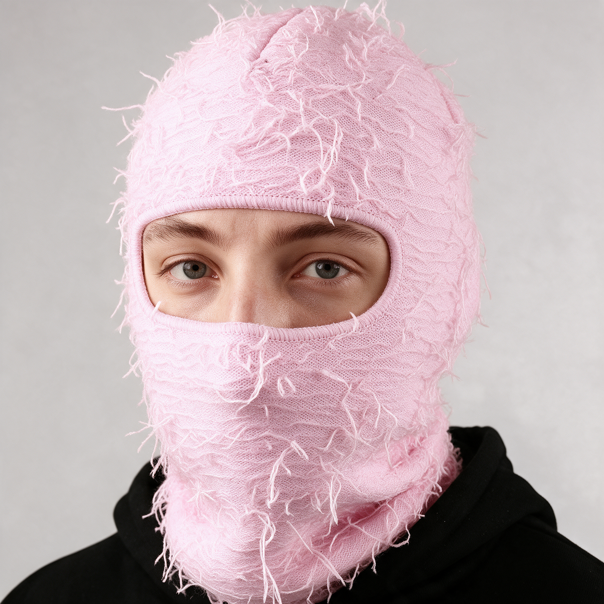 Pink distressed-knit balaclava — eye opening