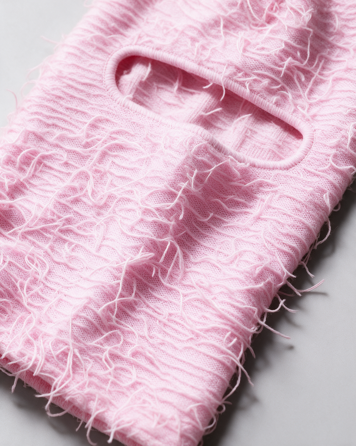 Pink distressed-knit balaclava — material close-up