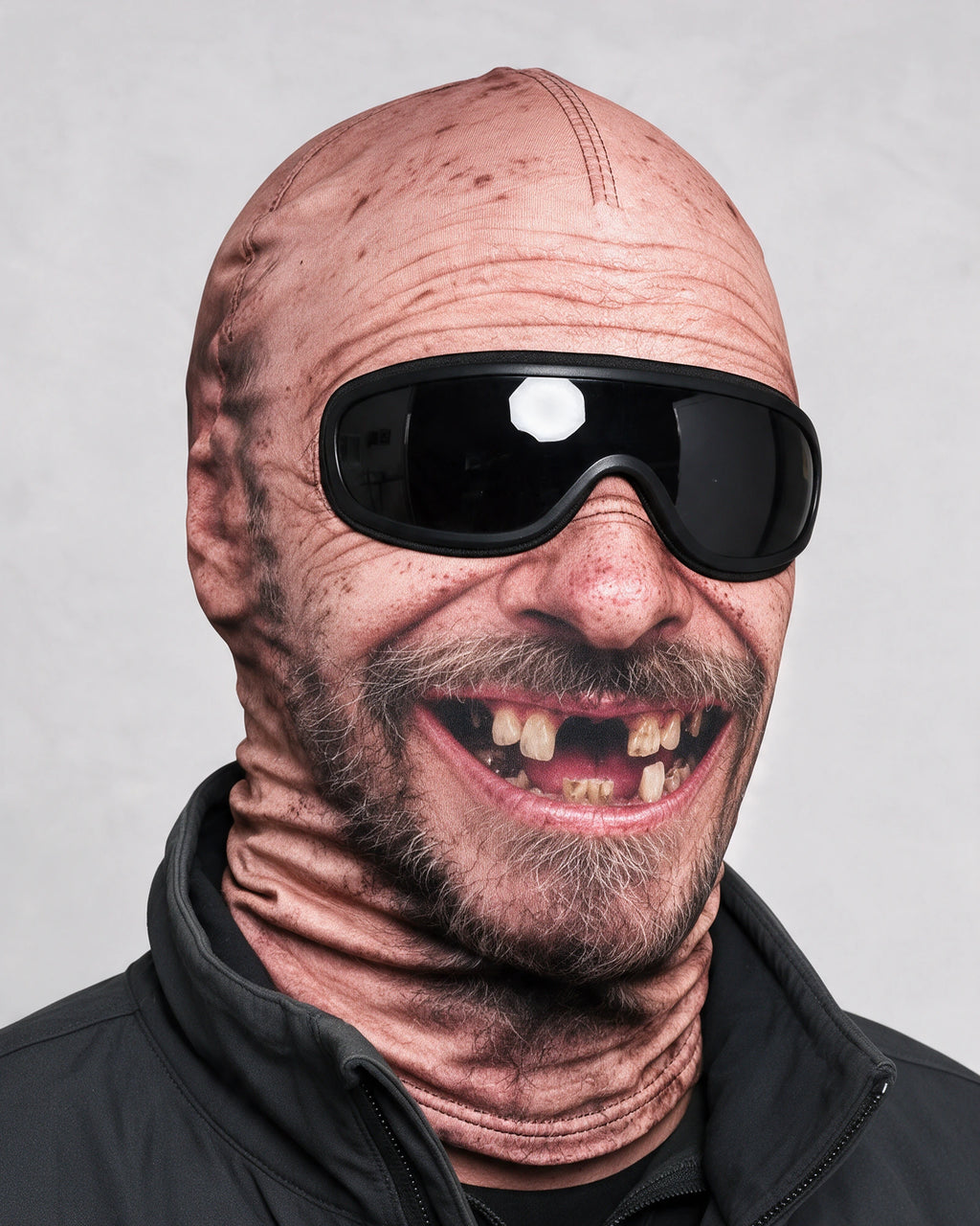 Printed fabric mask worn with ski goggles. Goggles and clothing not included.