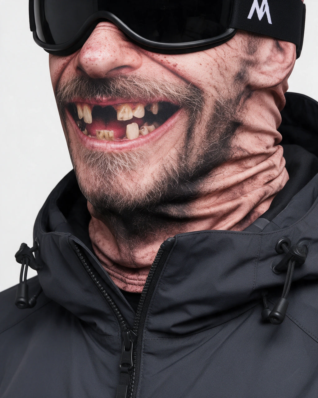 Printed fabric mask worn with ski goggles. Goggles and clothing not included.