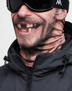 Printed fabric mask worn with ski goggles. Goggles and clothing not included.