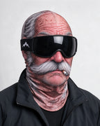 Printed fabric mask worn with ski goggles. Goggles and clothing not included.