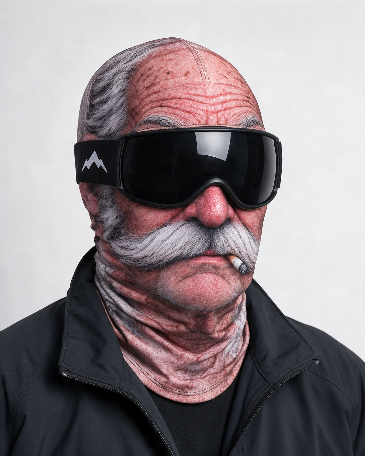 Printed fabric mask worn with ski goggles. Goggles and clothing not included.