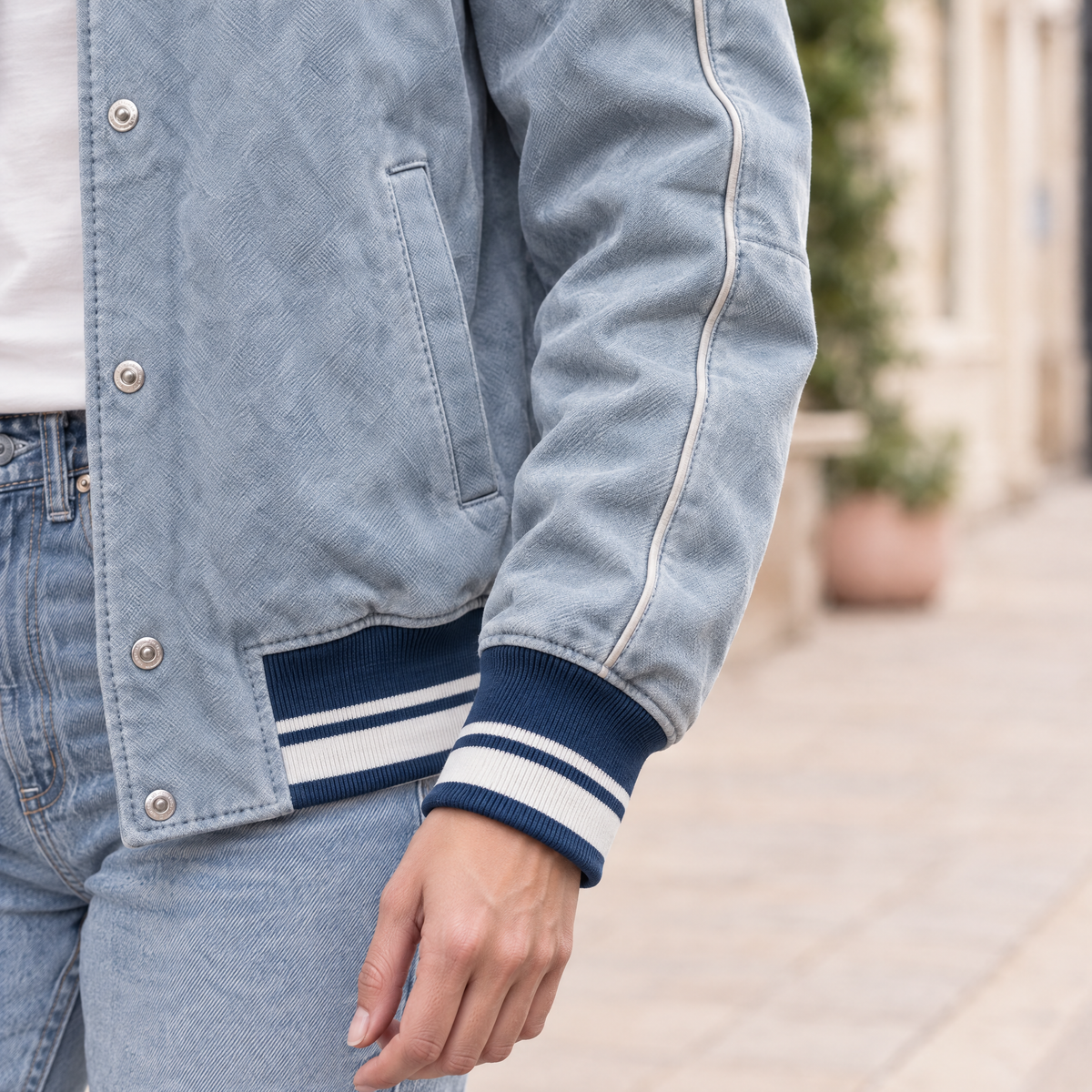 Women's Lena Leather Denim Varsity Jacket — Light Blue Wash — sleeve-detail