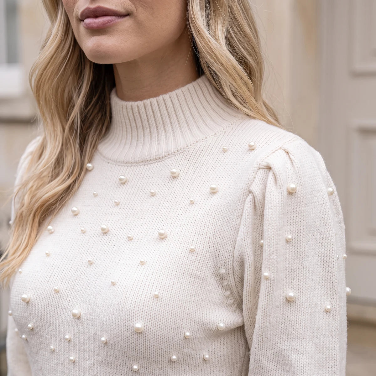 Ivory pearl-embellished sweater dress detail