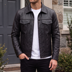 Men's black faux leather trucker jacket with pointed collar and flap chest pockets, front lifestyle view